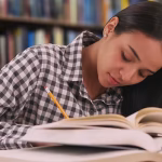 A woman studying in a library