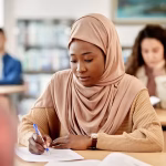 A woman sitting an exam