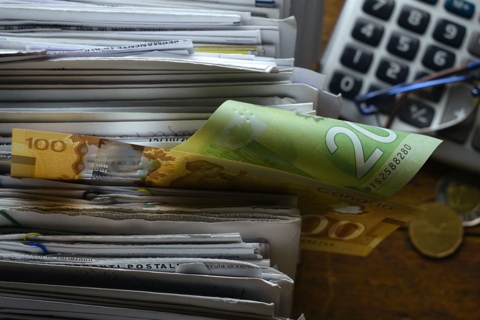A close up of letters, money and a calculator