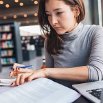 A woman studying in a library