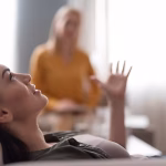 A woman laying down during a therapy session