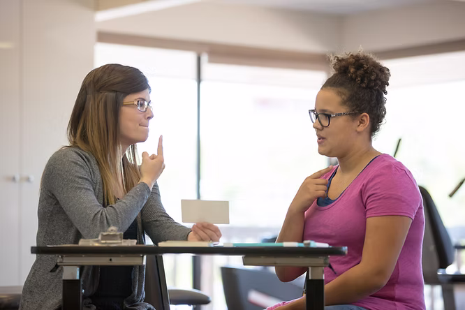 A health professional working with a client