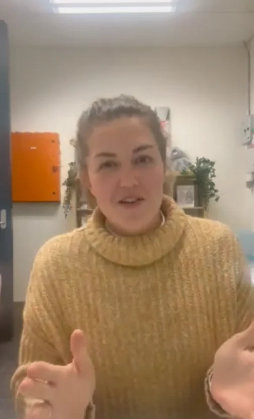 Laura speaking to the camera